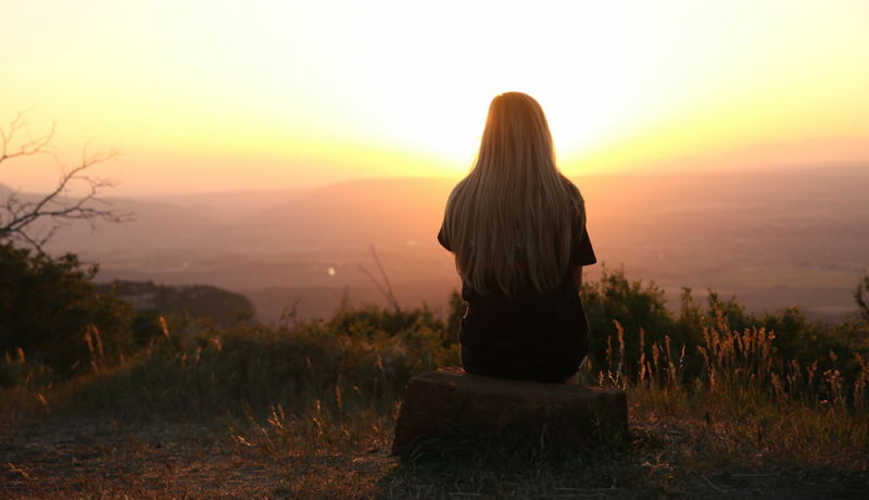 woman-sitting-watching-sunset